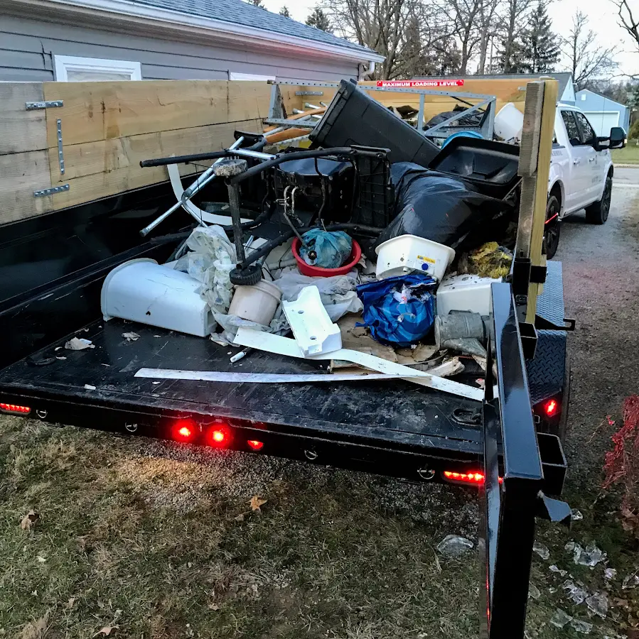 Roll-off dumpster delivered to a residential driveway in Brownsville
